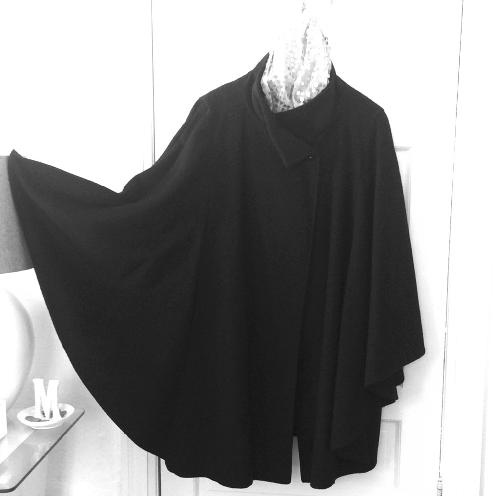 Cape with hidden sleeves